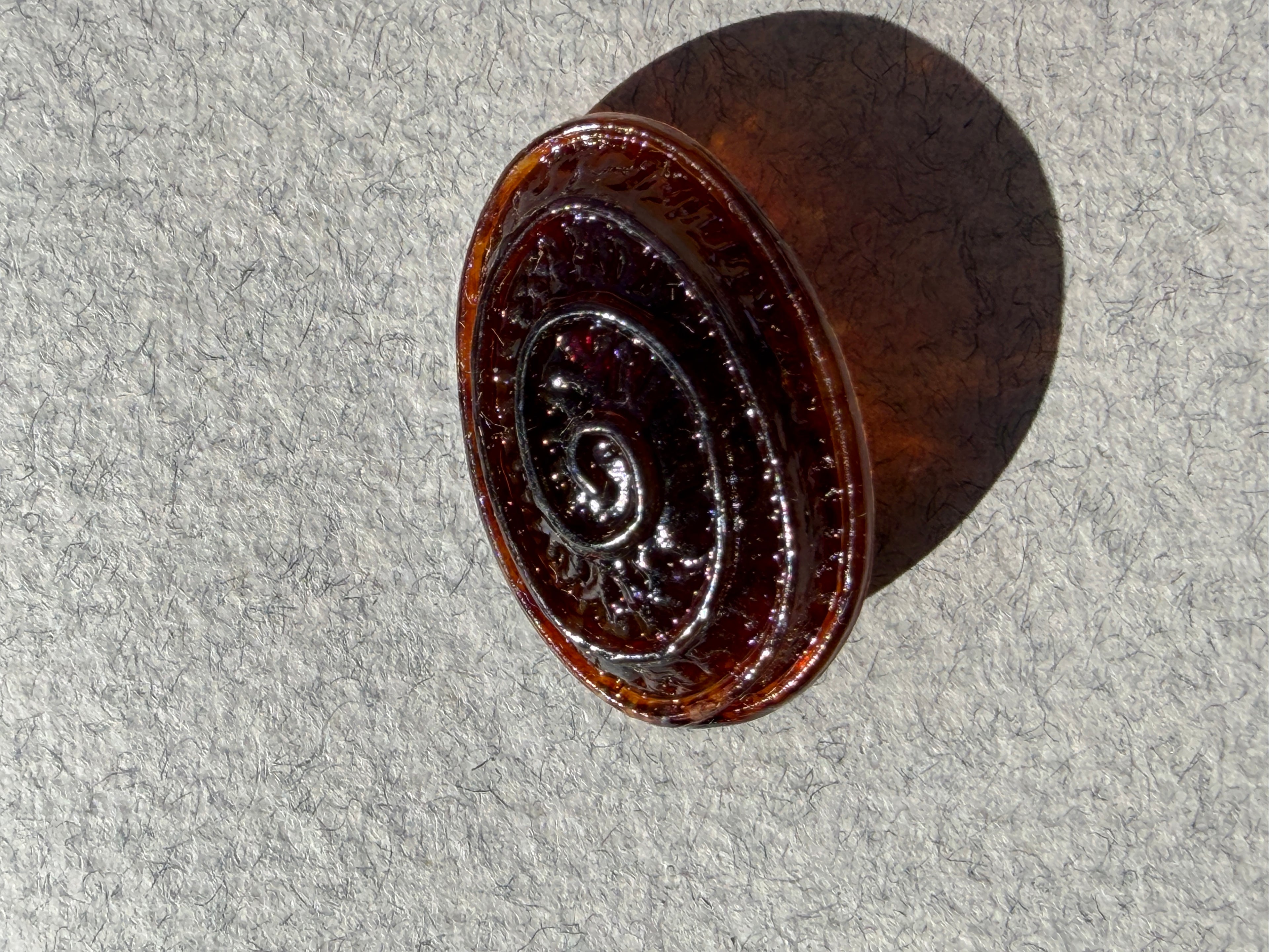 Oval brown resin scroll  shank button  P Haberdashery Auckland NZ