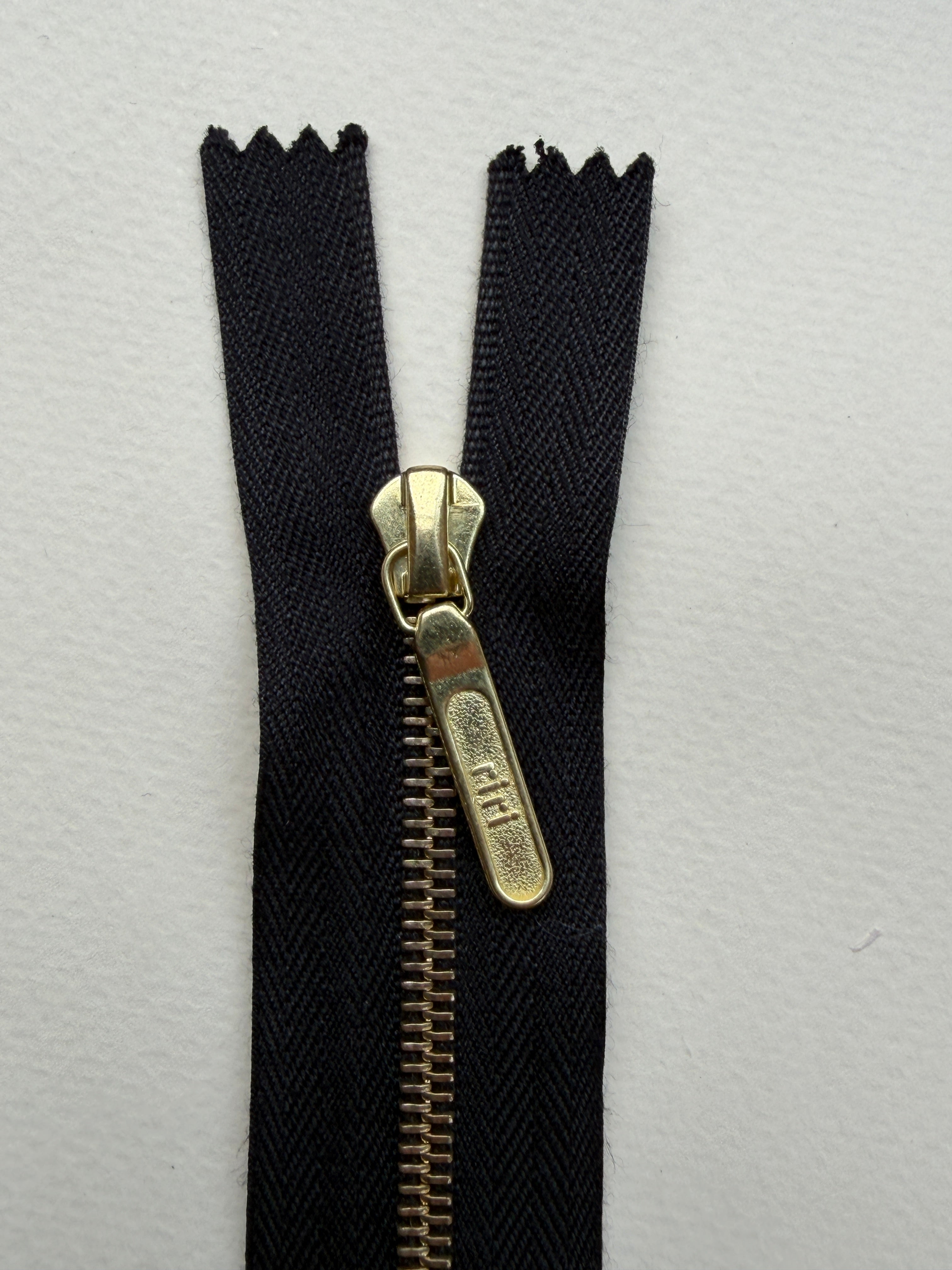 Close up Riri closed end metal zip black gold 11.5cm SP Haberdashery Auckland NZ
