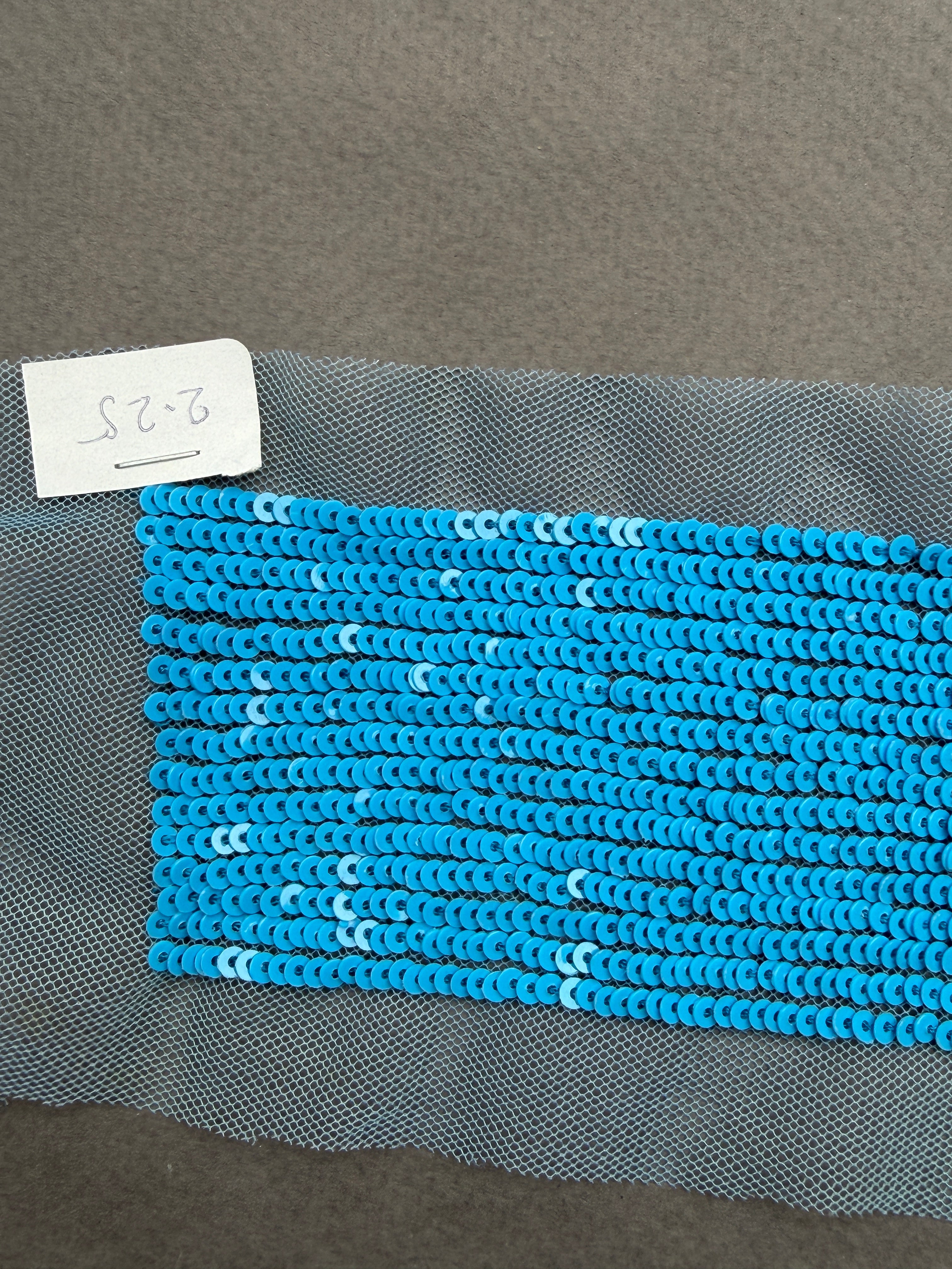 Close uo blue sequin net trim Auckland NZ
