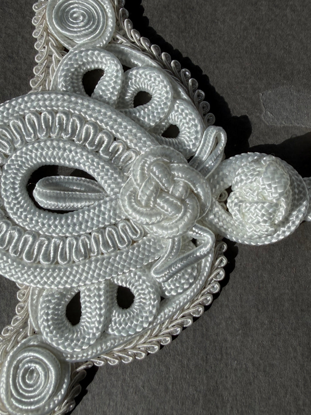 Close up white passementerie rayon frogging 14cm SP Haberdashery Auckland NZ