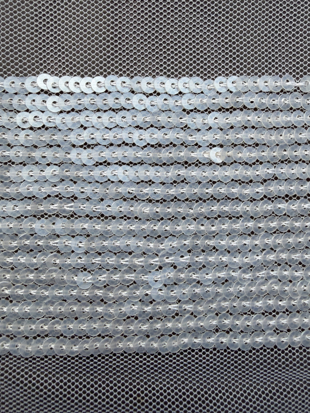 Close up white sequin trim  on net SP Haberdashery Auckland NZ