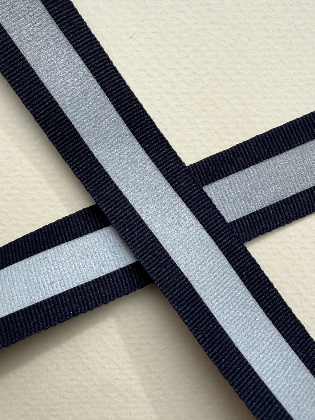 Close up navy woven ribbon with relective centre strip 20mm