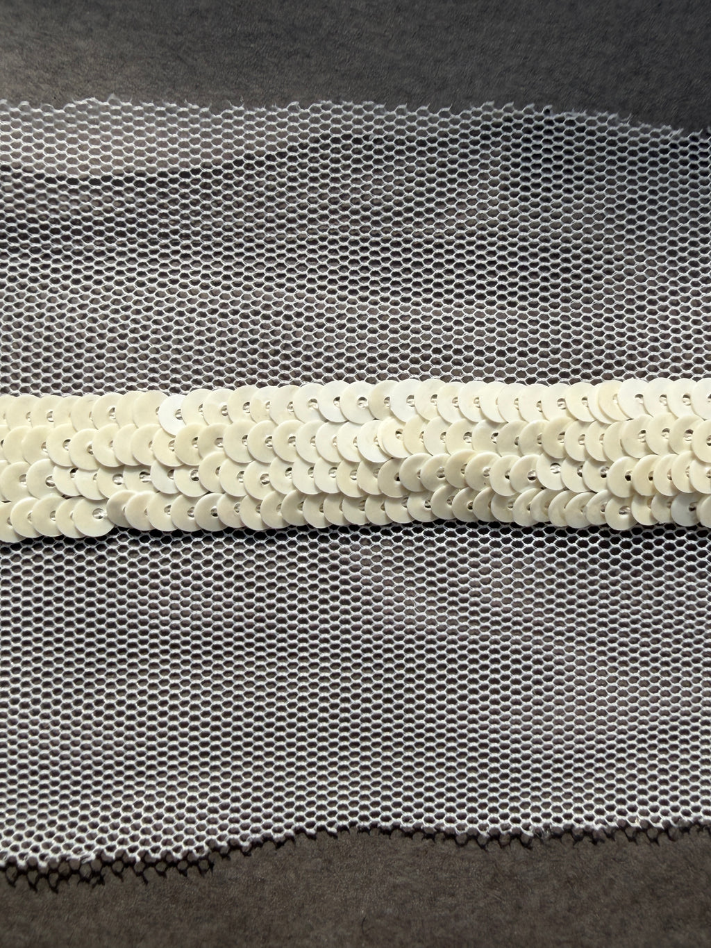 Pearl sequins sewn on net trim Auckland NZ