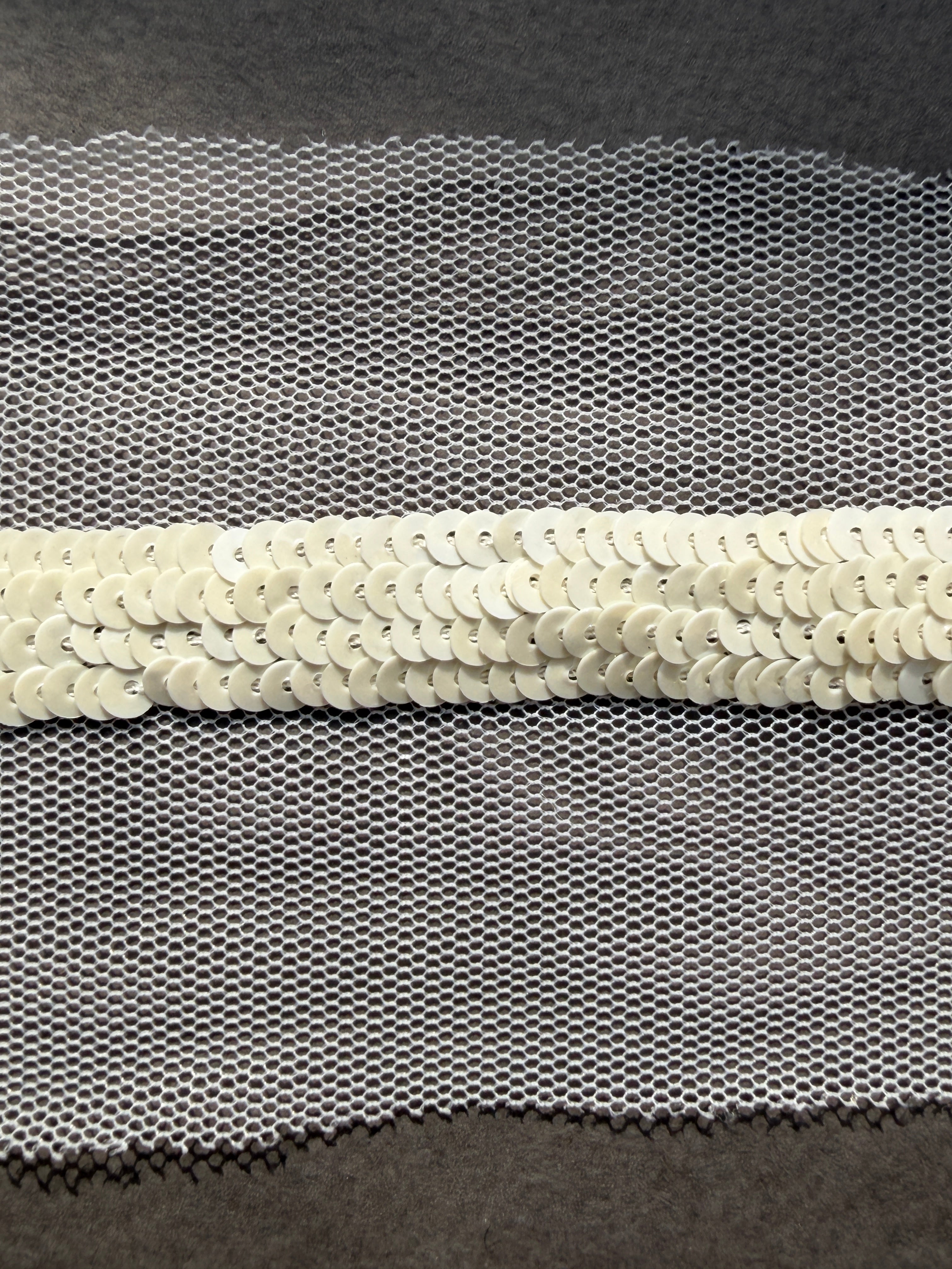 Pearl sequins sewn on net trim Auckland NZ