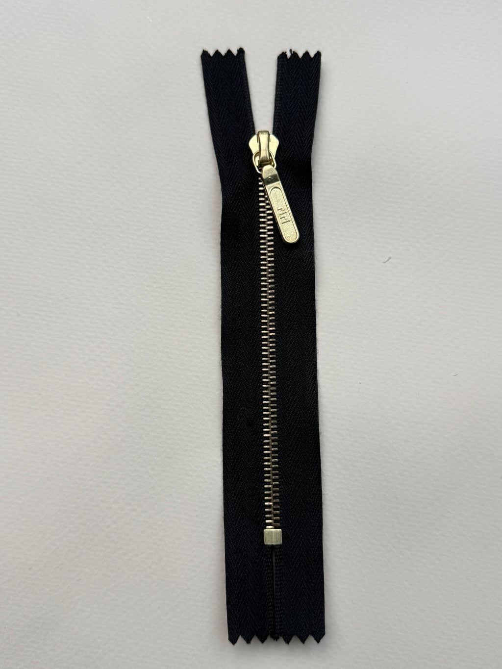 Riri closed end metal zip black gold  11.5cm SP Haberdashery Auckland NZ