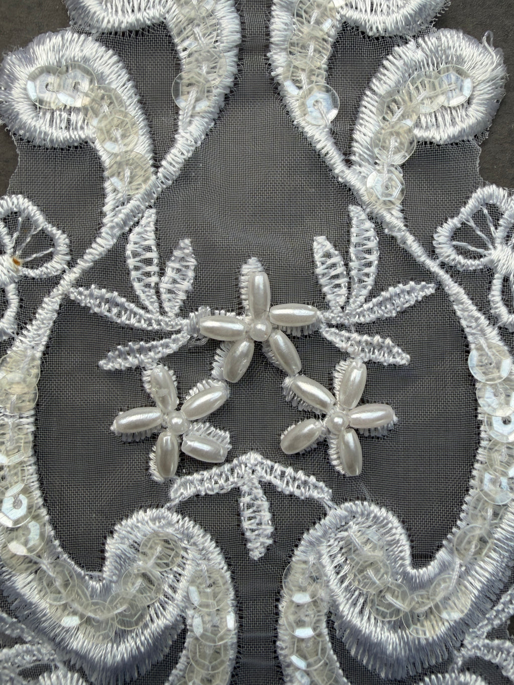Closeup white pearl sequin patch