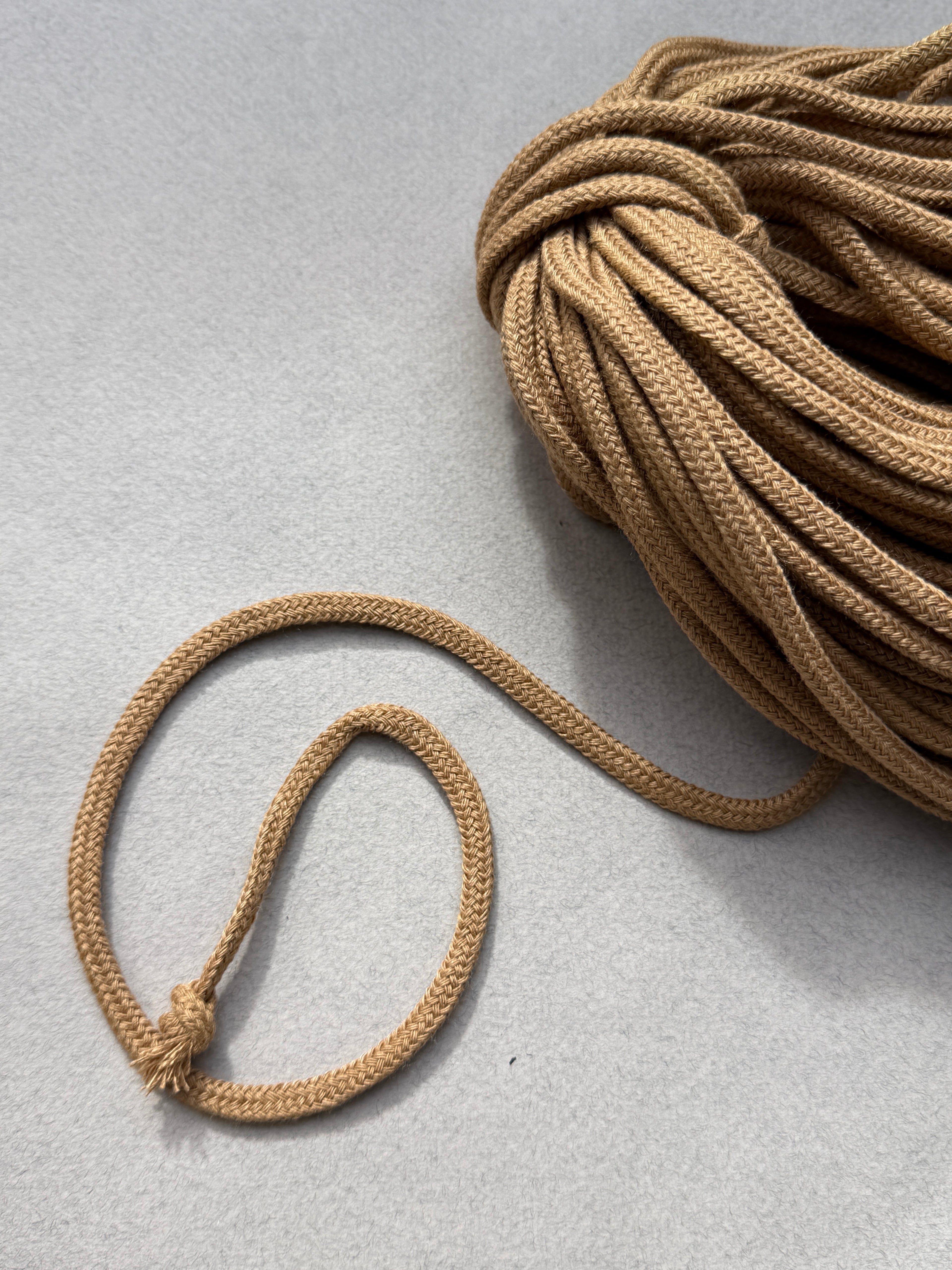 closeup tan acrylic spindle cord